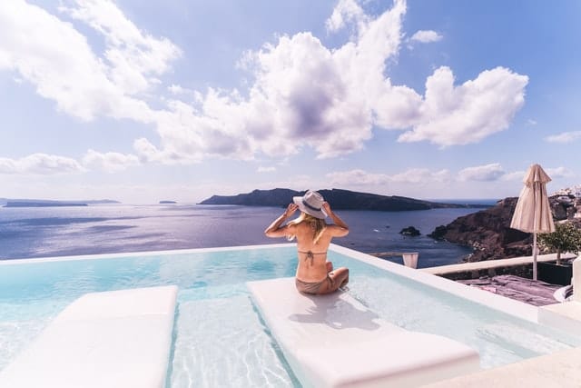 image of santorini swimming pool next to the sea