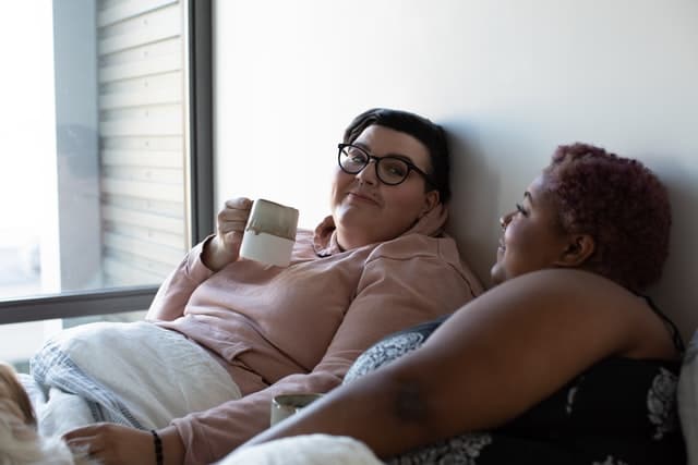 image of a lesbian couple lying down together