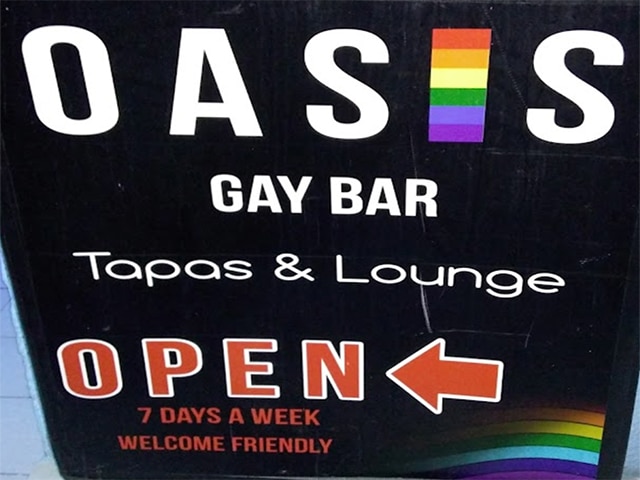 sign to Oasis Tapas & Lounge