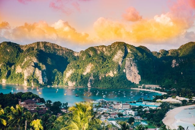 image of thailand at sunset with mountains and bay
