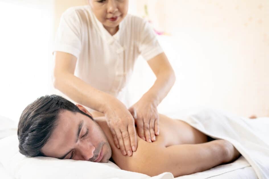 a  man undergoing a massage treatment