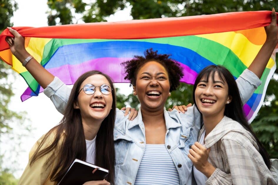 3 women and LGBT Flag 
