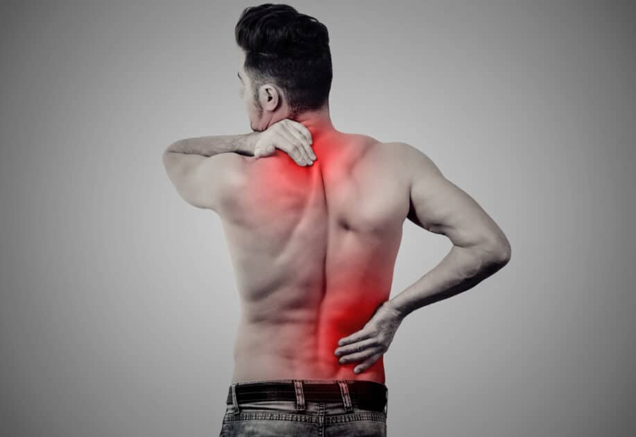 a young man suffering from Fibromyalgia the lower and upper back discomfort 
