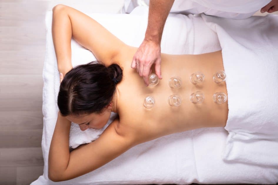 a woman having Cupping Therapy in spa