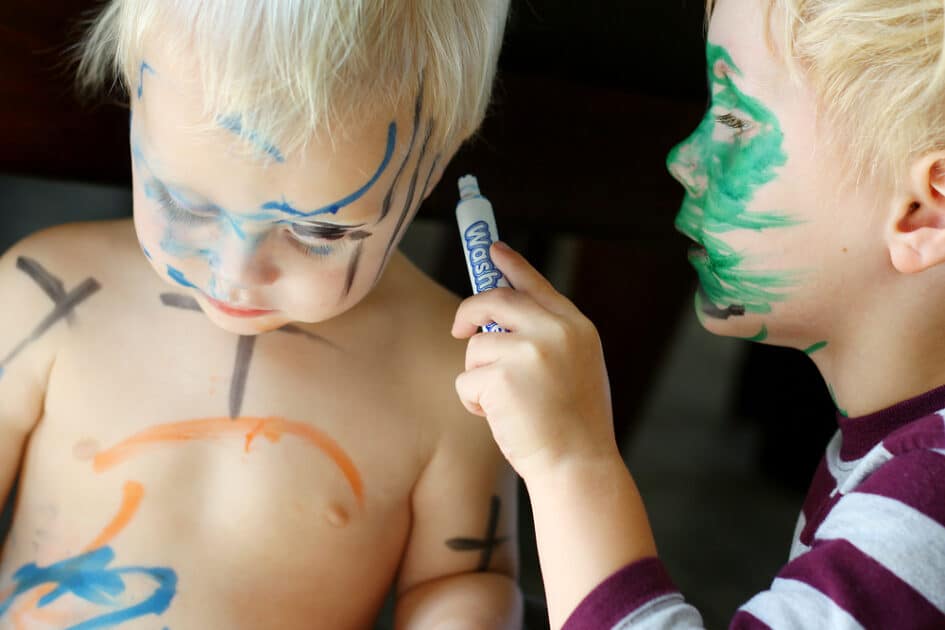 children playing marker on skin