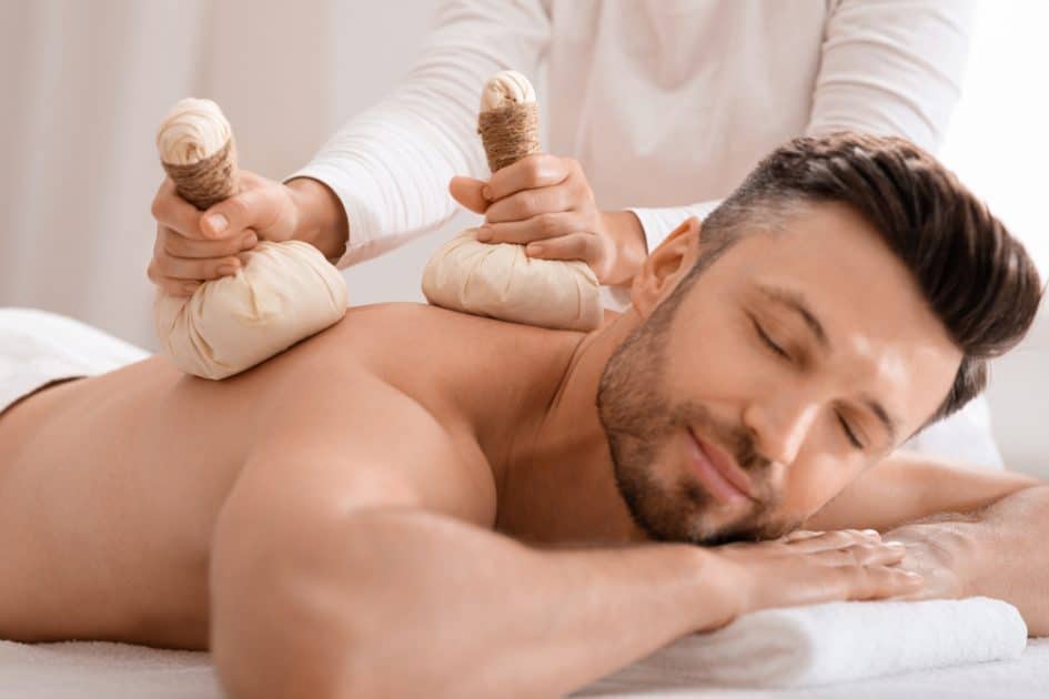 Man having  Herbal Compress Massage