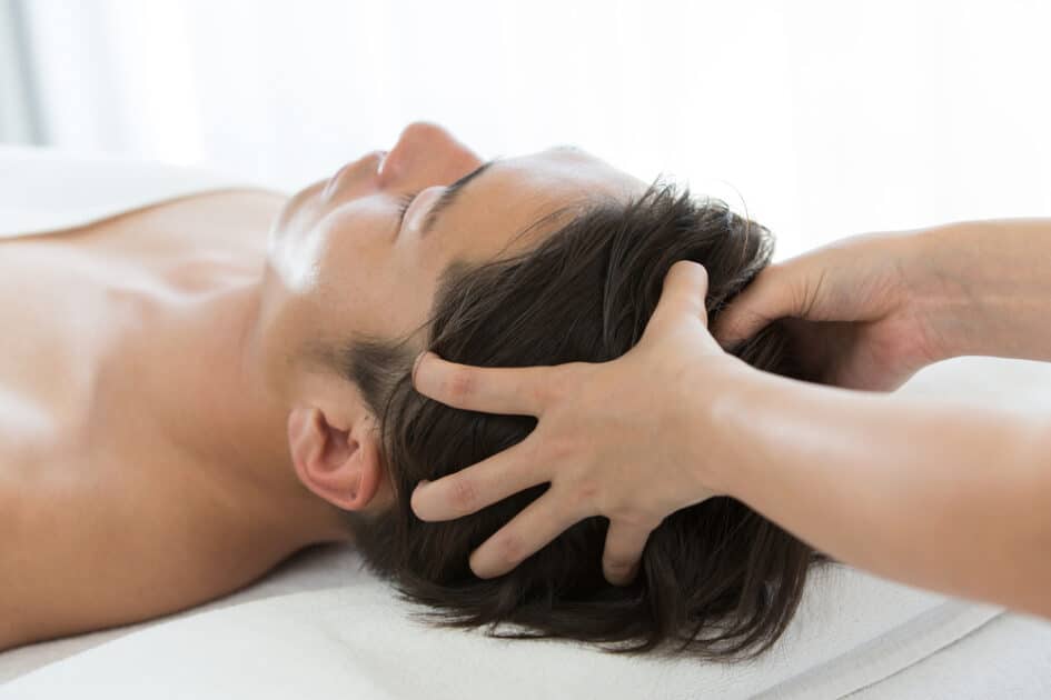 man getting massage for headaches