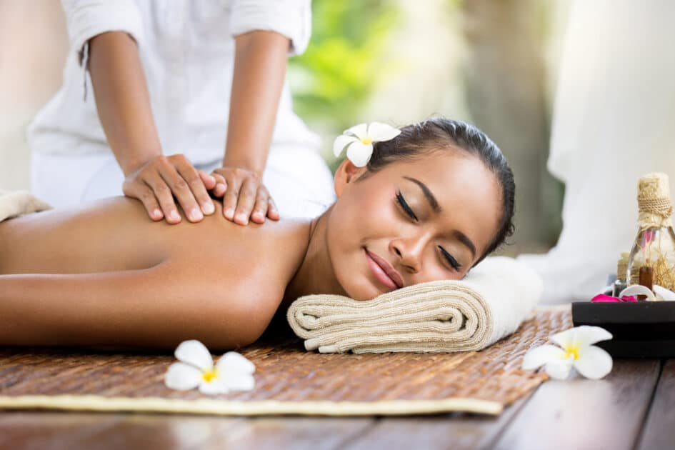 A Balinese woman gets a back massage.