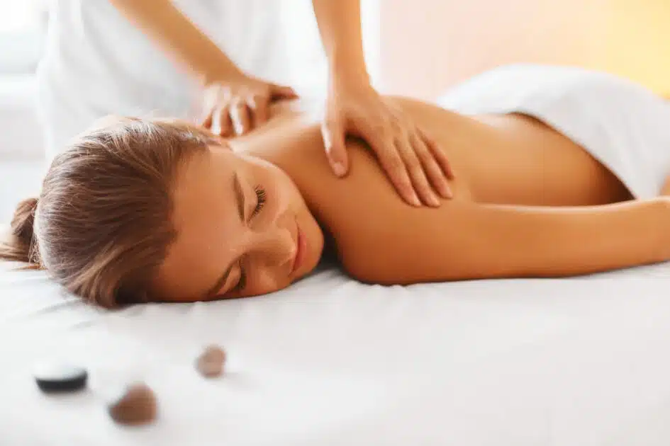 woman receives a pleasant back massage.
