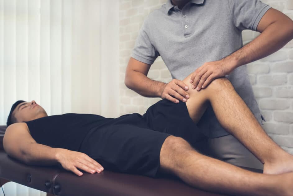 injured man performing remedial massage