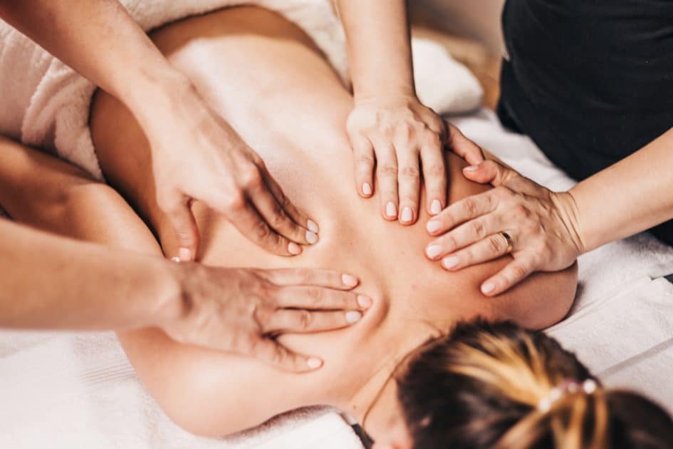 Woman receiving a Four Hands Massage